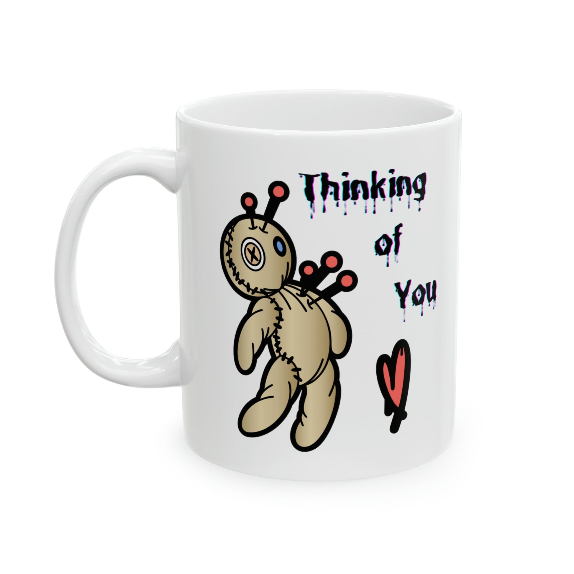 white ceramic coffee mug with a Voo doo doll being poked with pins.  The words Thinking of you are written in a scary dripping Halloween Font.  A red heart is under the wording.  Check out my shop at www.scorpiontees.etsy.com