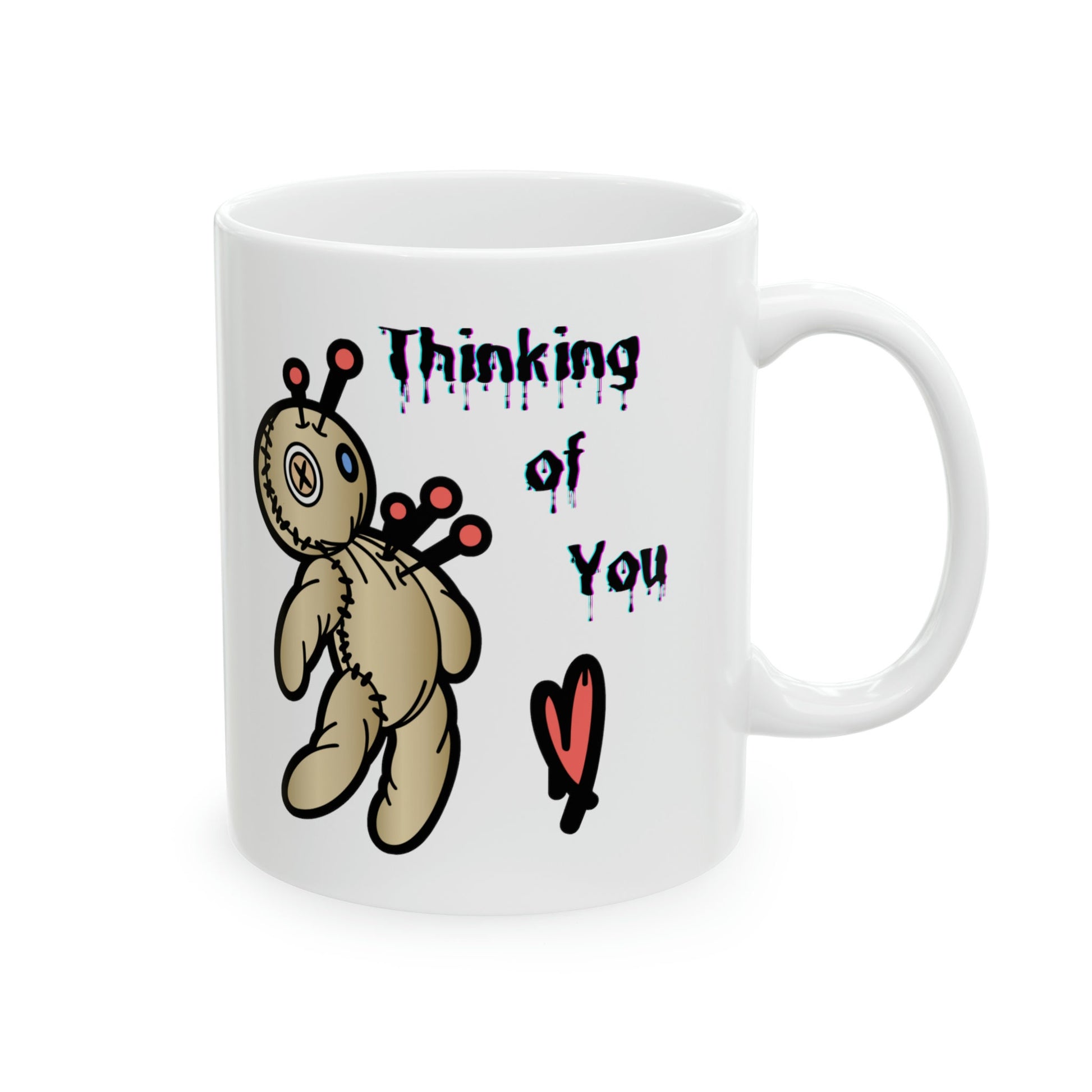 white ceramic coffee mug with a Voo doo doll being poked with pins.  The words Thinking of you are written in a scary dripping Halloween Font.  A red heart is under the wording.  Check out my shop at www.scorpiontees.etsy.com