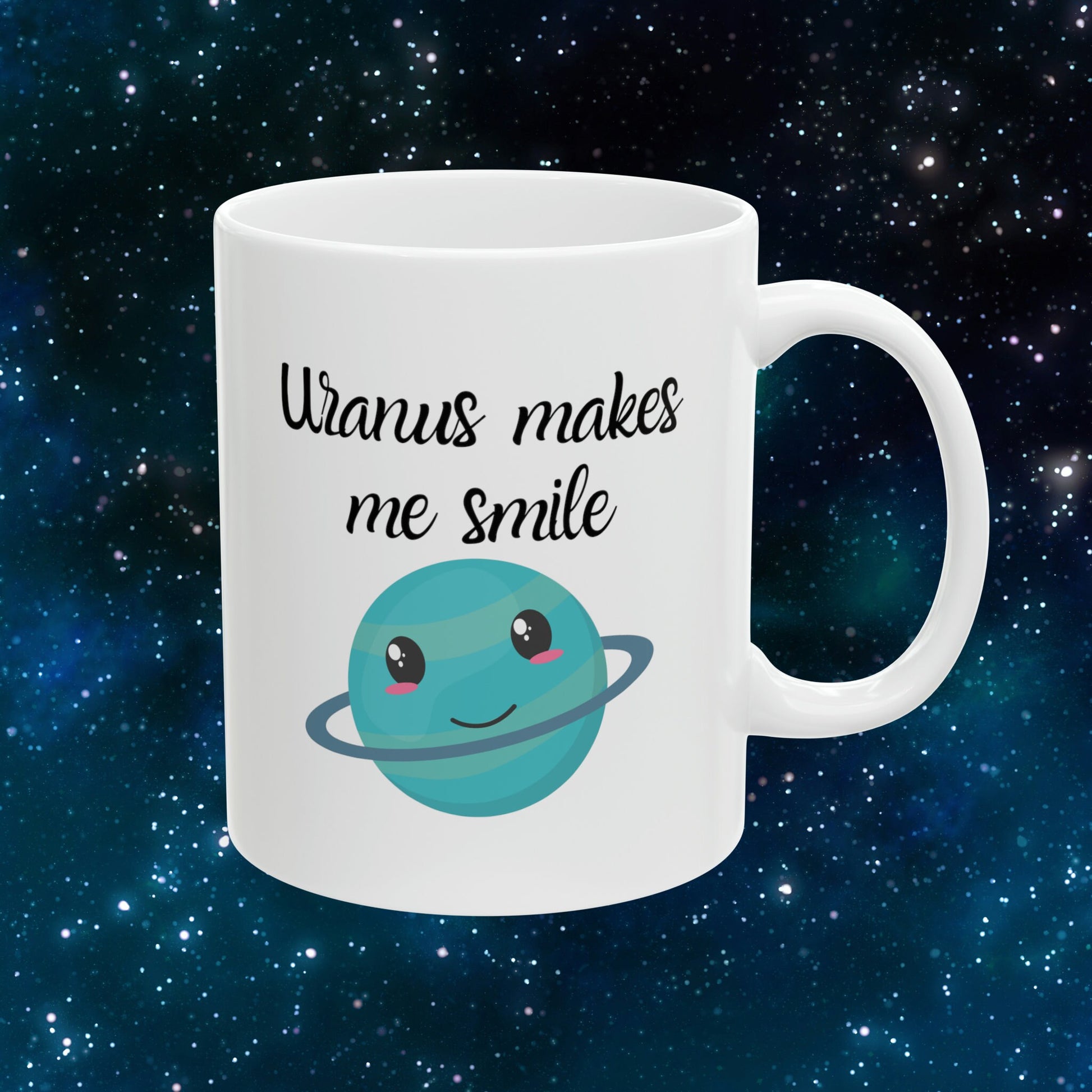 White Ceramic Mug with words in Script style black font that say, Uranus makes me smile. Beneath you find a Cute graphic of the Planet Uranus with an adorable face.  Check out the shop for more items at www.scorpiontees.etsy.com