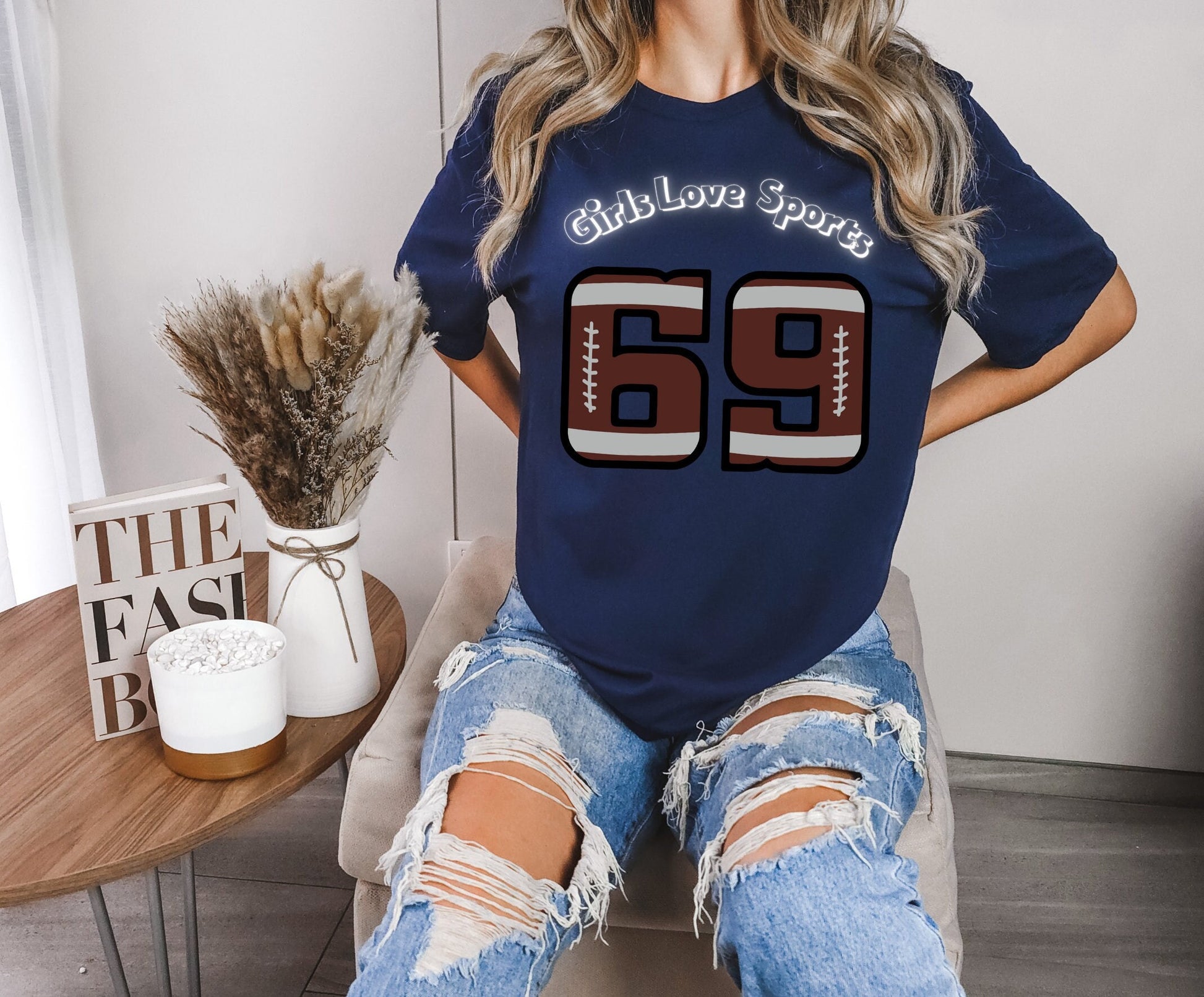 Awesome Graphic Tee Shirt for Women who love sports and have Bad Girl sense of Humor. The Shirt has the number 69 which has the patter of a Football and says Girls Love Sports above in a curved fashion.
www.scorpiontees.etsy.com