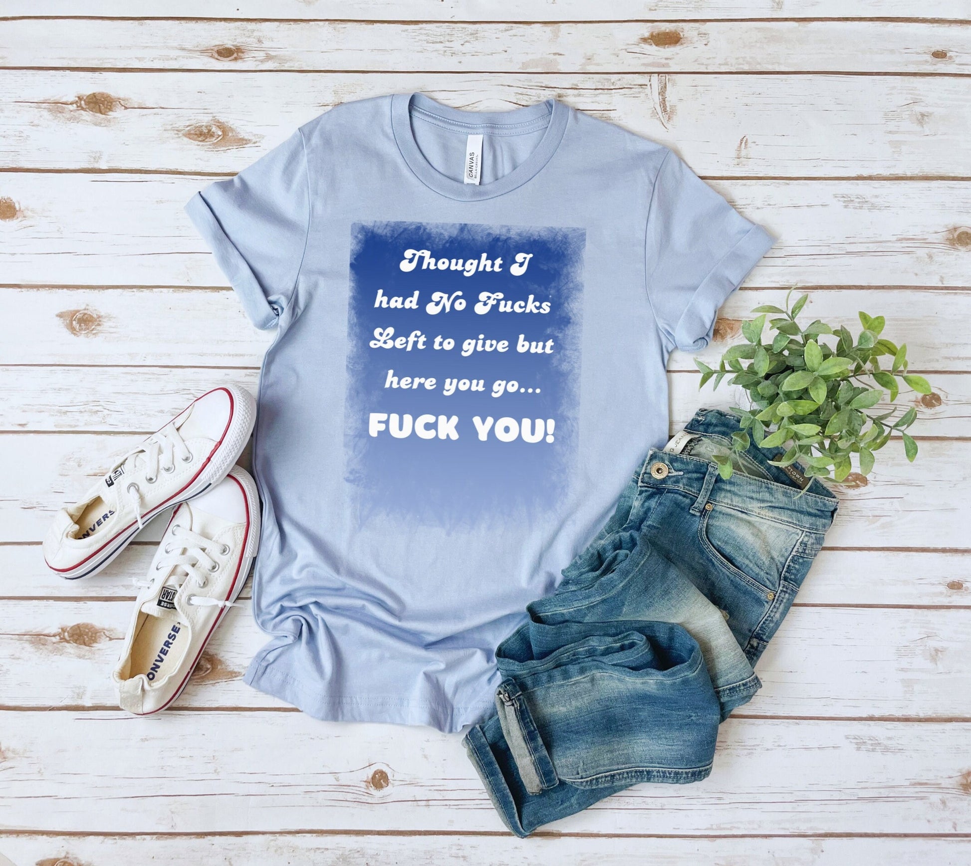 Awesome shirt. Design has blue backdrop with a grunge border.  The words on the design say Thought I had no fucks to give but here you go.  Fuck You! font color is white.
www.scorpiontees.etsy.com