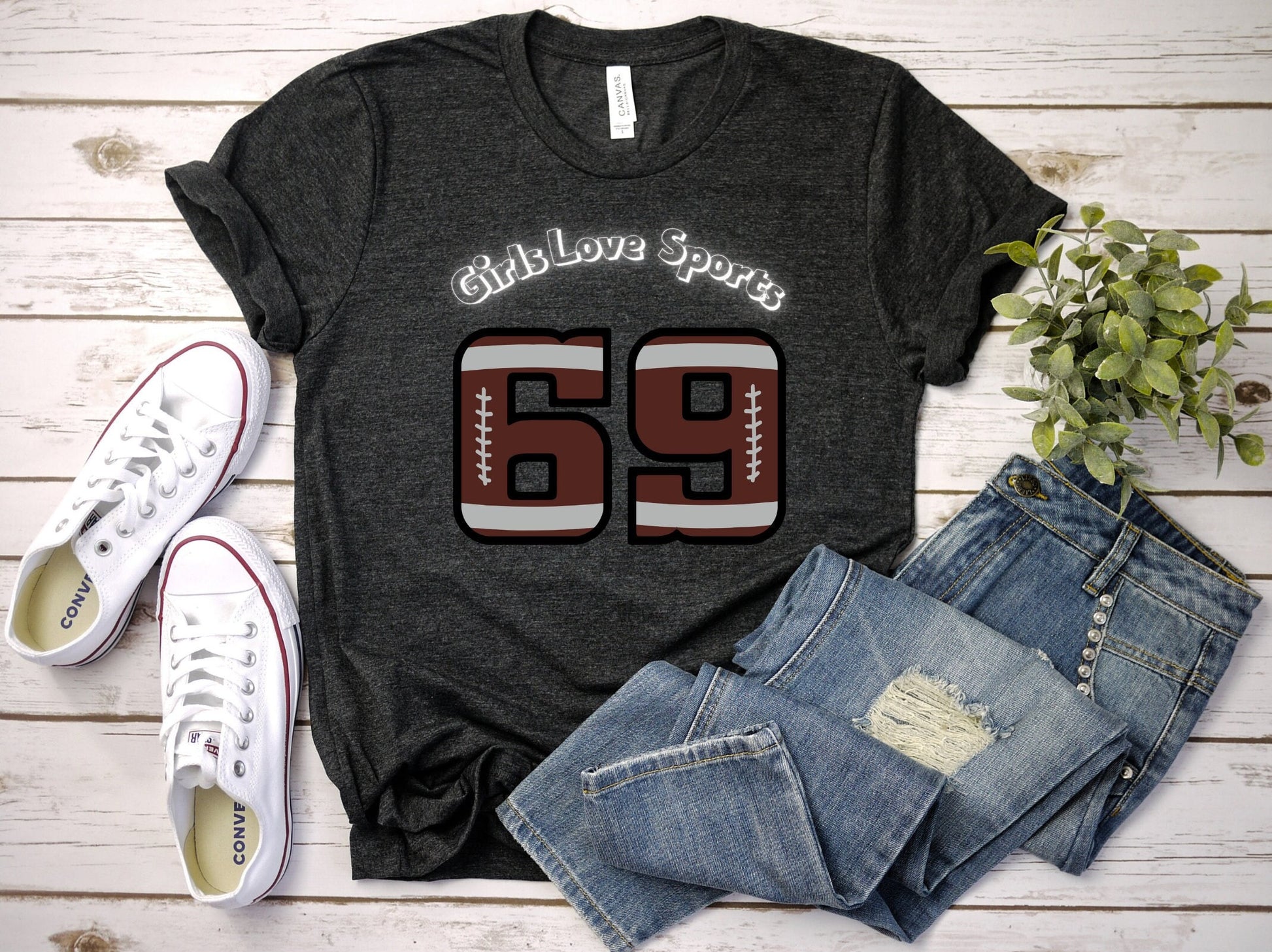 Awesome Graphic Tee Shirt for Women who love sports and have Bad Girl sense of Humor. The Shirt has the number 69 which has the patter of a Football and says Girls Love Sports above in a curved fashion.
www.scorpiontees.etsy.com