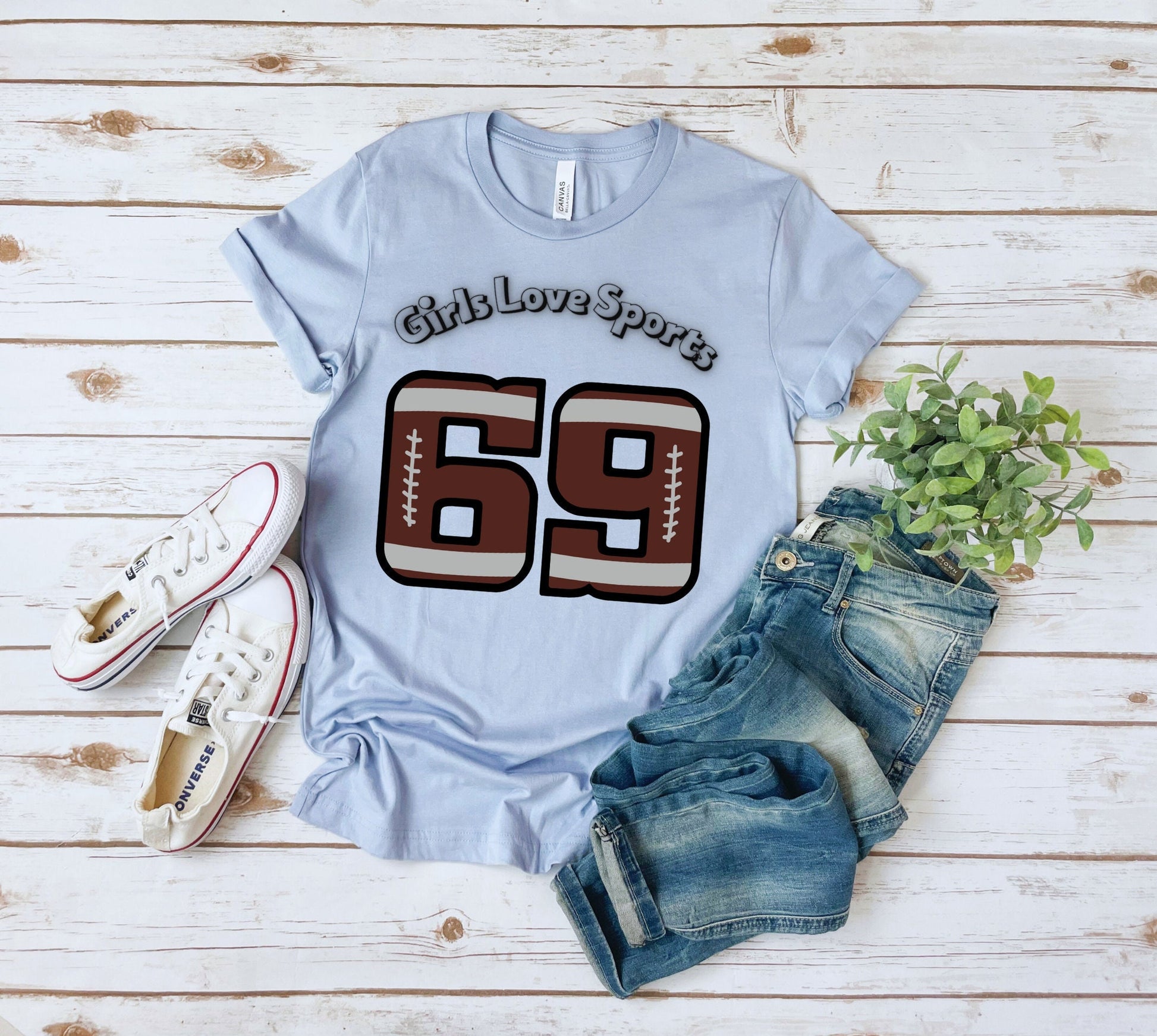 Awesome Graphic Tee Shirt for Women who love sports and have Bad Girl sense of Humor. The Shirt has the number 69 which has the patter of a Football and says Girls Love Sports above in a curved fashion.
www.scorpiontees.etsy.com