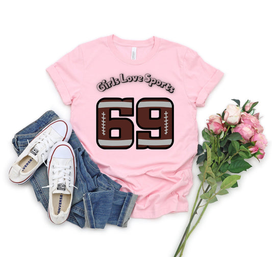 Awesome Graphic Tee Shirt for Women who love sports and have Bad Girl sense of Humor. The Shirt has the number 69 which has the patter of a Football and says Girls Love Sports above in a curved fashion.
www.scorpiontees.etsy.com