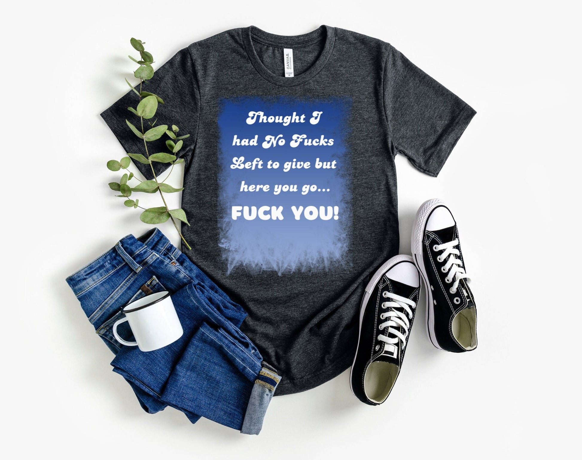 Awesome shirt. Design has blue backdrop with a grunge border.  The words on the design say Thought I had no fucks to give but here you go.  Fuck You! font color is white.
www.scorpiontees.etsy.com