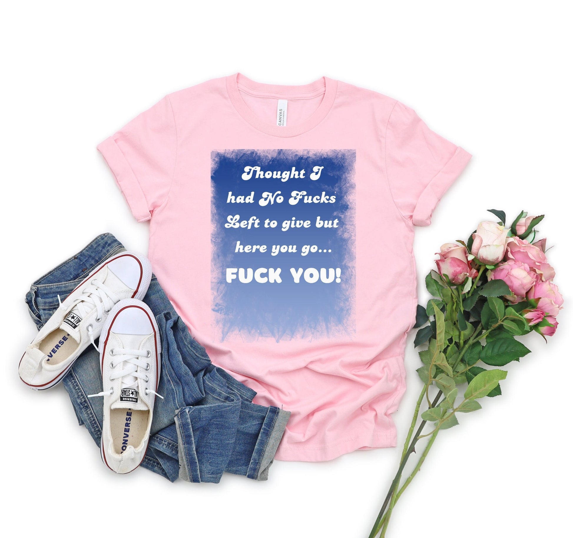 Awesome shirt. Design has blue backdrop with a grunge border.  The words on the design say Thought I had no fucks to give but here you go.  Fuck You! font color is white.
www.scorpiontees.etsy.com