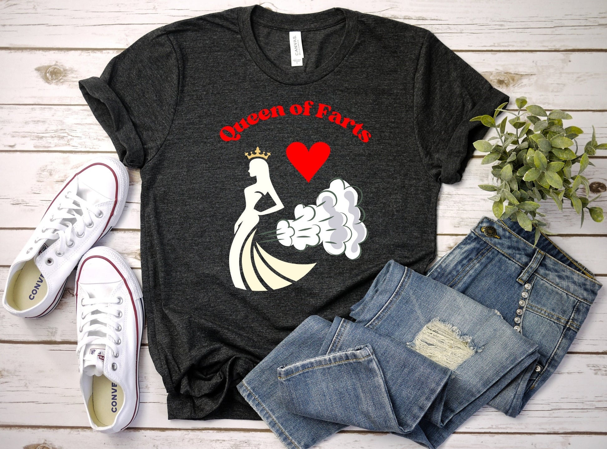 Funny T shirt with the words Queen of Hearts in Red.  The main image is of a queen with her crown and what appears as smoke trailing behind her. There is a red heart between the queen and the words.  See more great shirts at www.scorpiontees.etsy.com