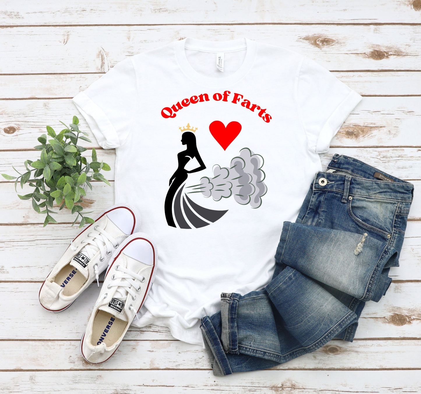 Funny T shirt with the words Queen of Hearts in Red.  The main image is of a queen with her crown and what appears as smoke trailing behind her. There is a red heart between the queen and the words.  See more great shirts at www.scorpiontees.etsy.com