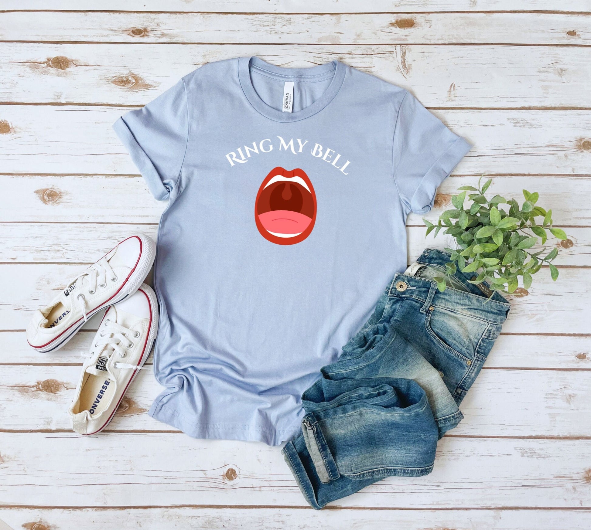 Funny and Naughty t Shirt with the words Ring My Bell written on a Curve.  Beneath the words is image of an Open Mouth With the Uvula visible.  The Uvula symbolizes the bell to be rung.  www.scorpiontees.etsy.com