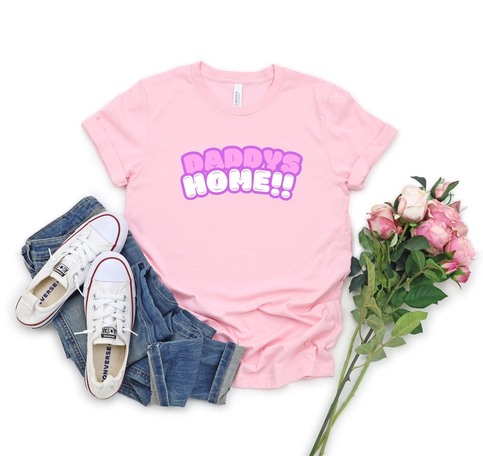 Bella and Canvas 3001 T-Shirt with the words Daddys Home in a really cute pink and white font. The font has a soft purple outline. Very cute and trendy shirt for that special someone. www.scorpiontees.etsy.com