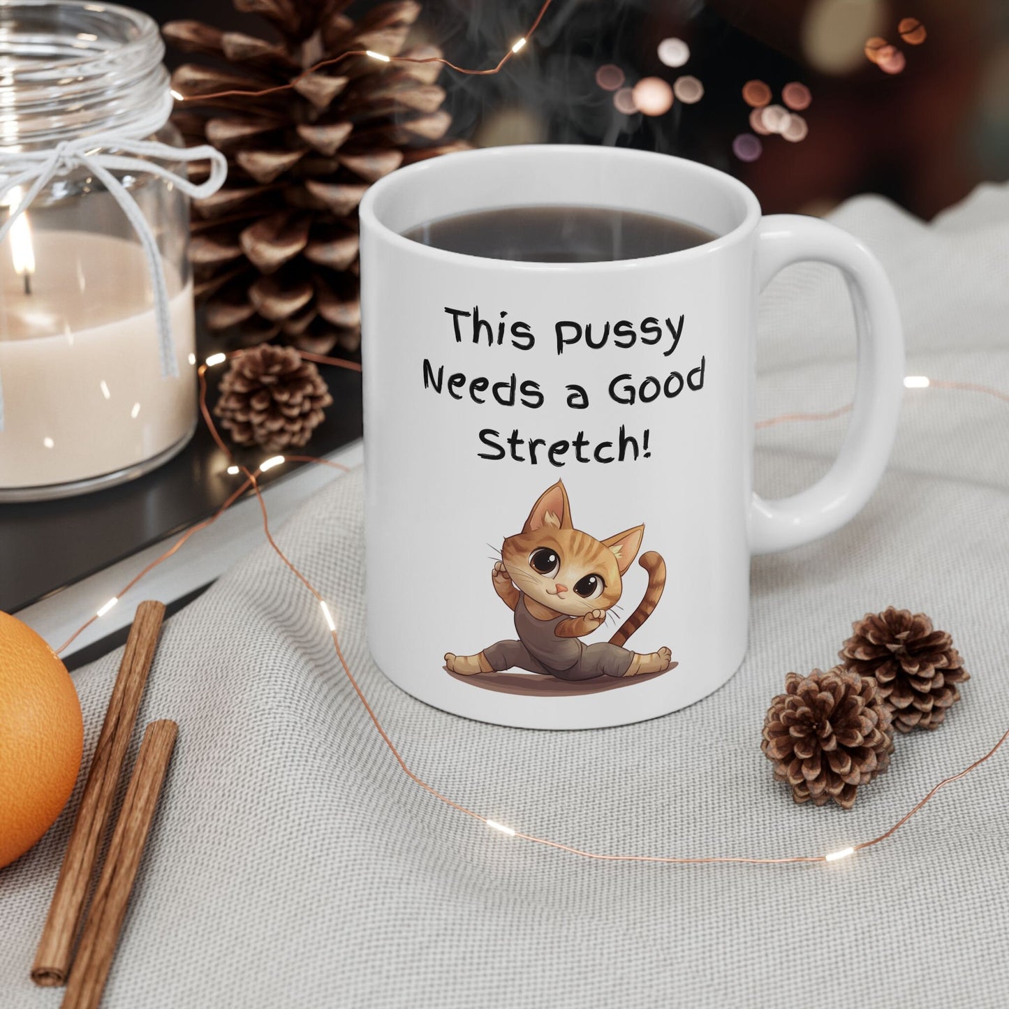 White Ceramic 11oz coffee mug with the Words This pussy needs a good stretch in finger paint font. Below the words there is a Cartoon cat stretching doing a split. Hilarious sexy mug for you coffee tea or favorite drink 
www.scorpiontees.etsy.com