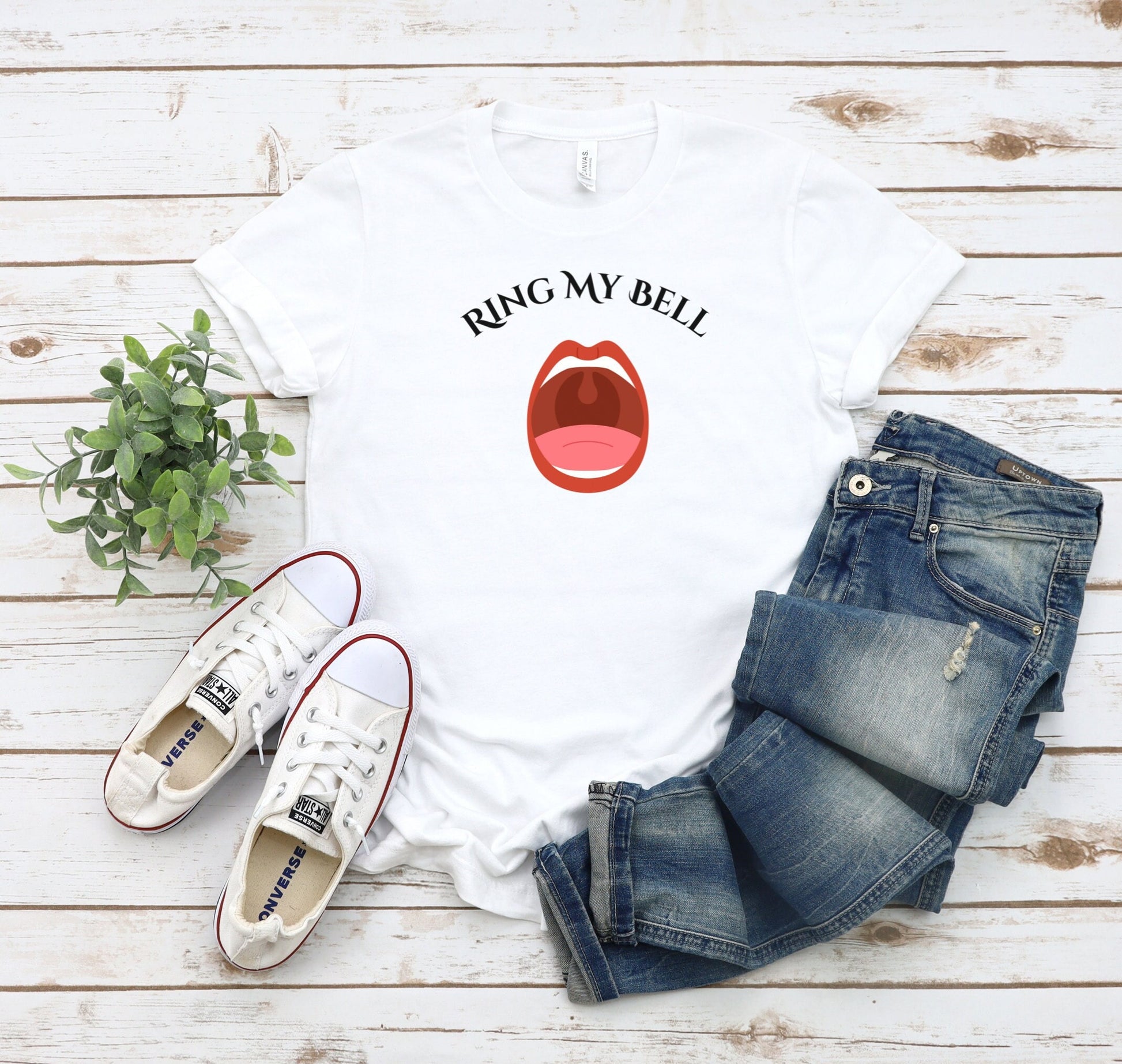 Funny and Naughty t Shirt with the words Ring My Bell written on a Curve.  Beneath the words is image of an Open Mouth With the Uvula visible.  The Uvula symbolizes the bell to be rung.  www.scorpiontees.etsy.com