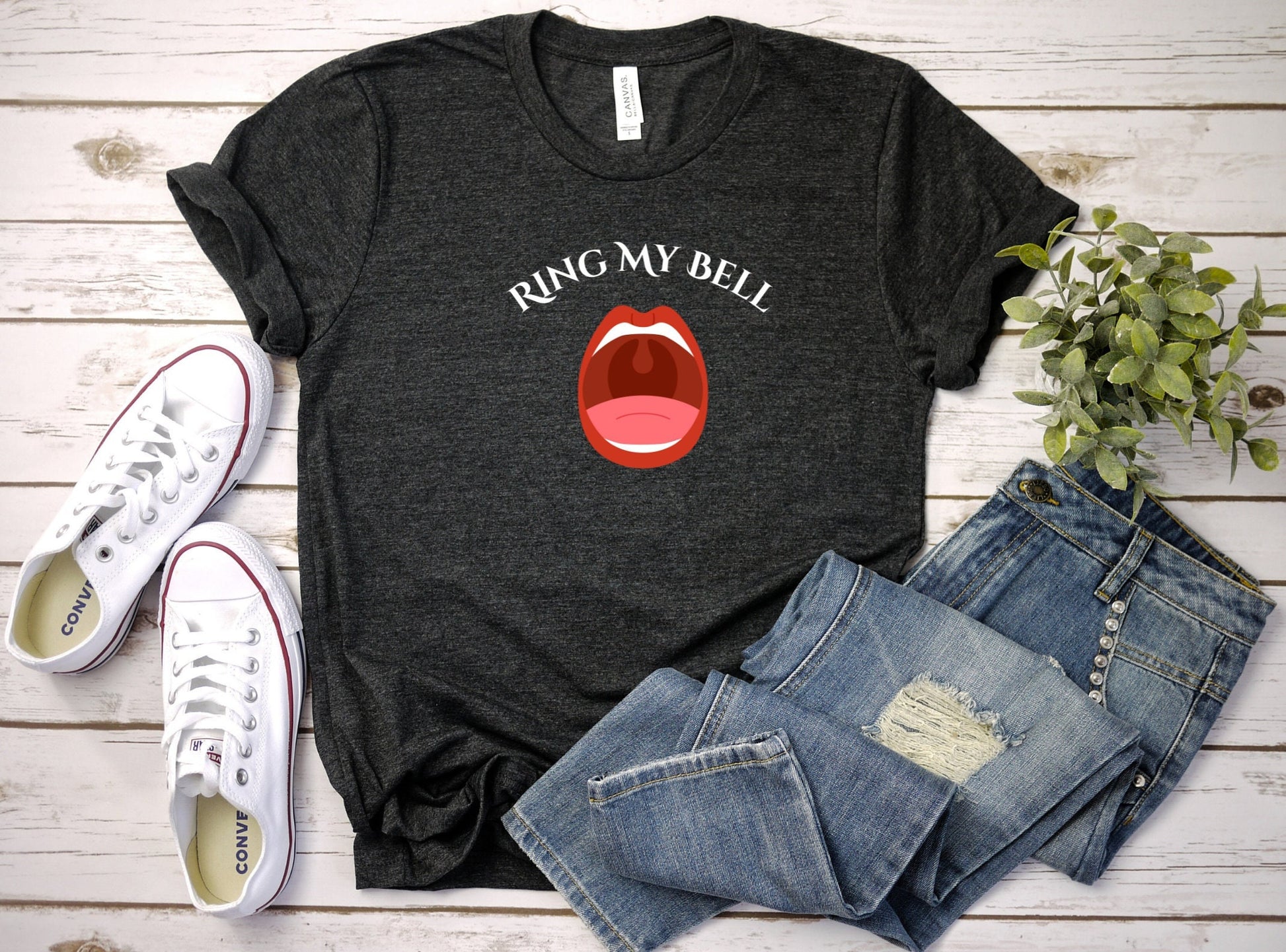 Funny and Naughty t Shirt with the words Ring My Bell written on a Curve.  Beneath the words is image of an Open Mouth With the Uvula visible.  The Uvula symbolizes the bell to be rung.  www.scorpiontees.etsy.com