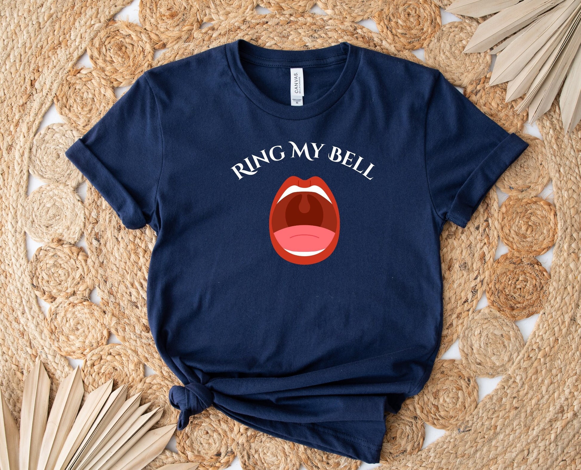 Funny and Naughty t Shirt with the words Ring My Bell written on a Curve.  Beneath the words is image of an Open Mouth With the Uvula visible.  The Uvula symbolizes the bell to be rung.  www.scorpiontees.etsy.com