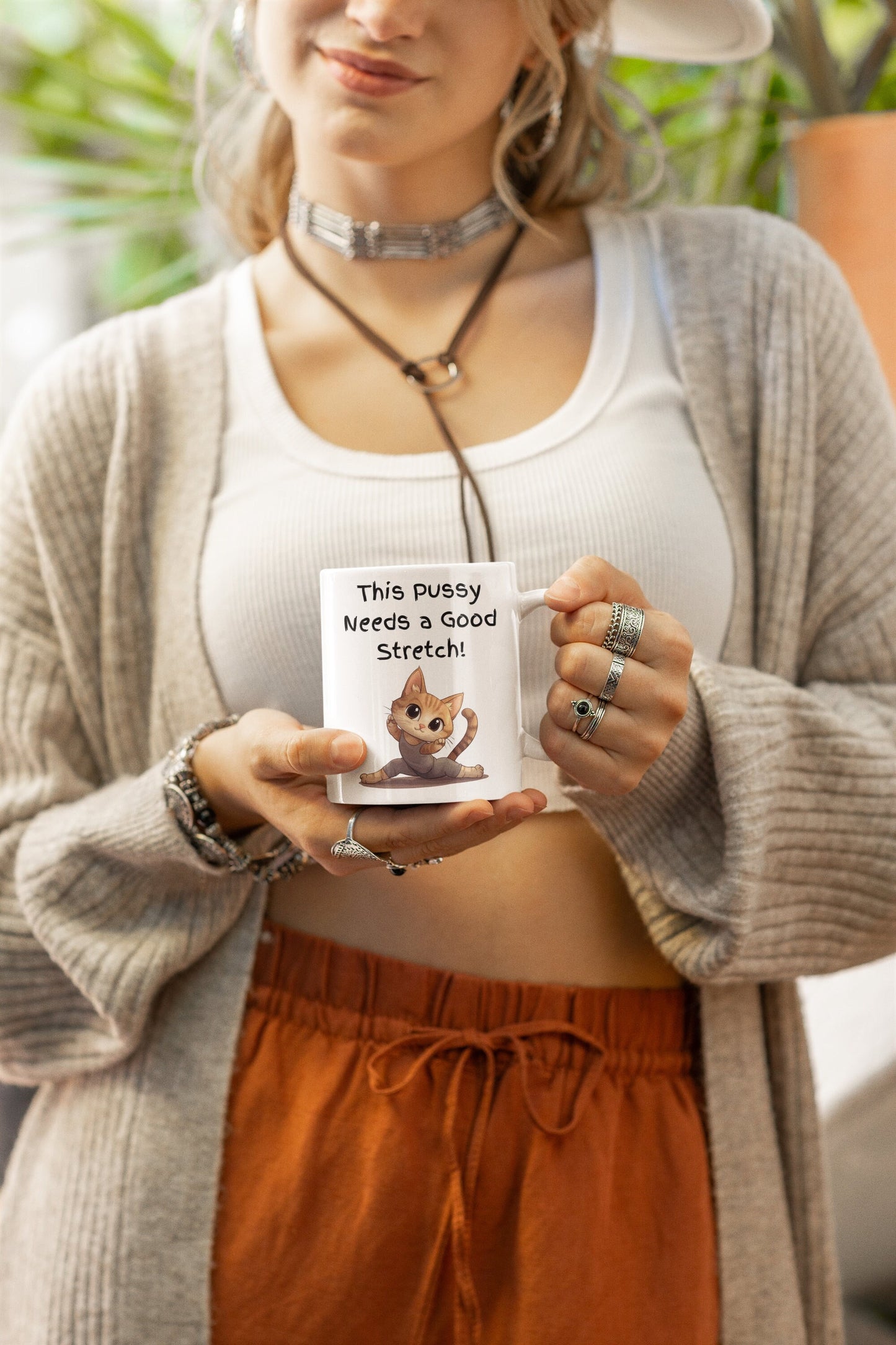 White Ceramic 11oz coffee mug with the Words This pussy needs a good stretch in finger paint font. Below the words there is a Cartoon cat stretching doing a split. Hilarious sexy mug for you coffee tea or favorite drink 
www.scorpiontees.etsy.com