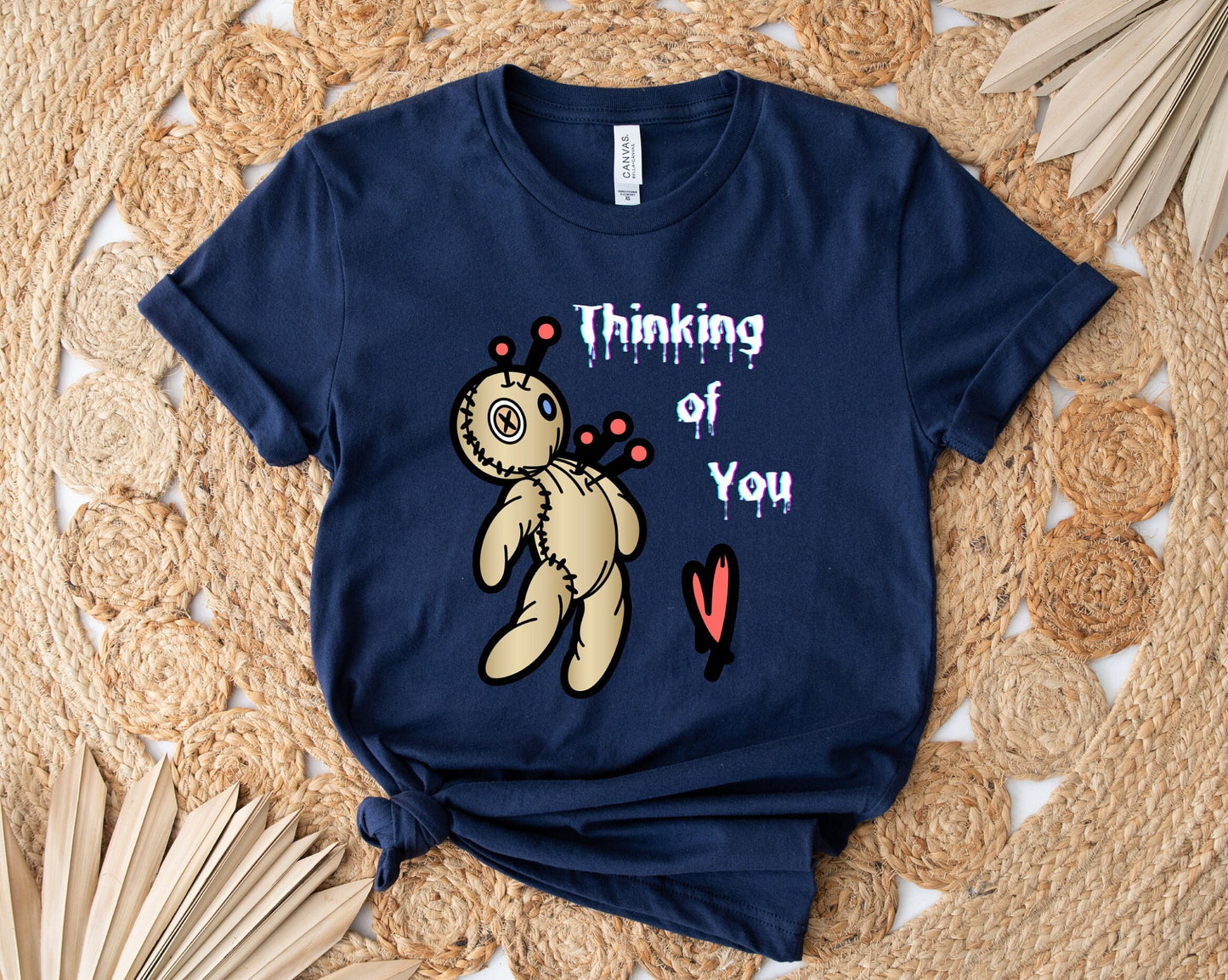 Thinking of you Voodoo doll T shirt. Scorned lover or sarcastic thoughts as voodoo doll is being stuck with pins in his heart. Hilariously cute design on a comfortable T shirt.  Perfect gift for Halloween or just for fun.
www.scorpiontees.etsy.com