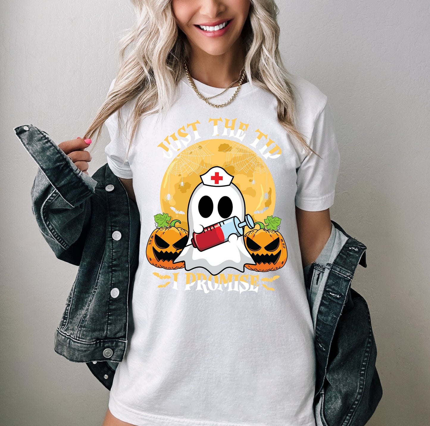 Just the Tip I promise Halloween Nursing Ghost T shirt.  This stylish Tee has a cool design of a Ghost with a nurse hat holding a syringe next to pumpkins spiders and bats. Makes a perfect gift for Halloween and for nurses.
www.scorpiontees.etsy.com